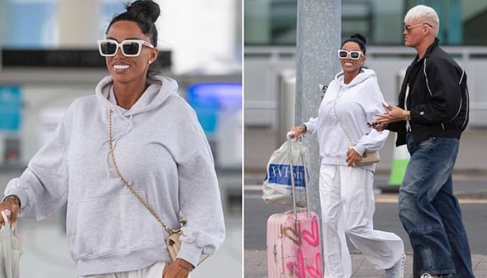 Katie Price appeared in high spirits as she departed Newcastle Airport, flashing a huge smile