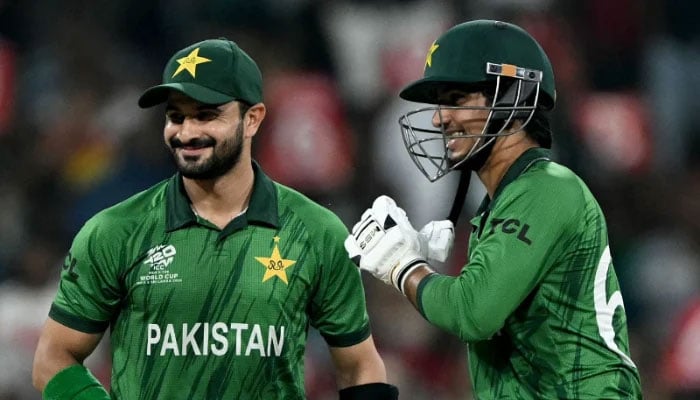Pakistan openers Sahibzada Farhan (left) and Saim Ayub interact during the 2026 ICC Mens T20 Cricket World Cup group stage match against the USA at the Sinhalese Sports Club (SSC) Ground in Colombo on February 10, 2026. - AFP