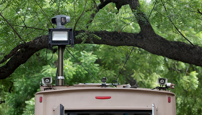 A CCTV camera atop a mobile command and control vehicle at the ongoing protest site, days after thousands of supporters of Indias Cockroach Janta Party (CJP) marched towards parliament demanding the resignation of Education Minister Dharmendra Pradhan over National Eligibility cum Entrance Test (NEET) examination paper leaks, at Jantar Mantar in New Delhi, July 24, 2026. — Reuters