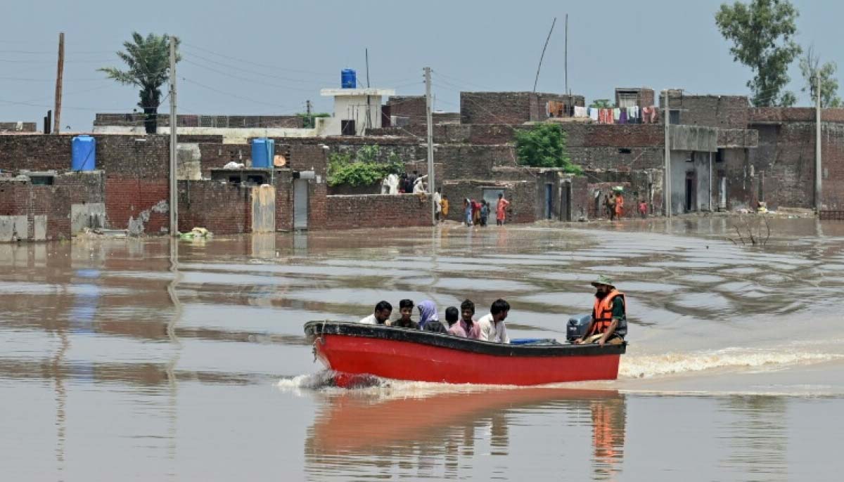 This image shows small motor boats chartered by volunteers ferrying residents to safety. — AFP