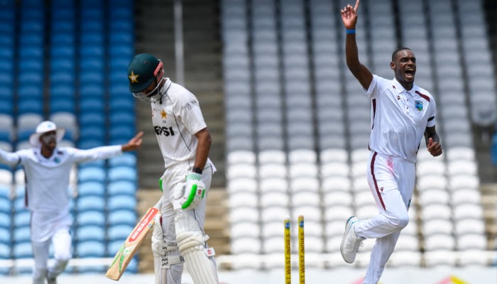Pakistan batter Shan Masood (left) bowled by West Indies Justin Greaves (right) during the third day of first Test at Brian Lara Cricket Academy in Tarouba, Trinidad and Tobago on July 27, 2026. — AFP