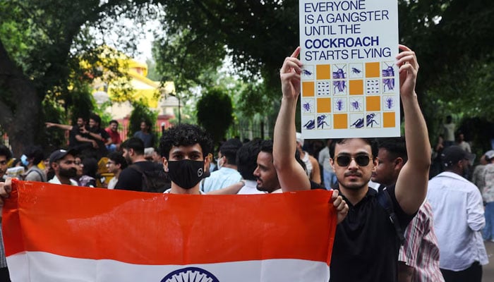 Cockroach Janta Party (CJP) supporters celebrate after the resignation of Education Minister Dharmendra Pradhan over National Eligibility cum Entrance Test (NEET) examination paper leaks, at Jantar Mantar in New Delhi, India July 25, 2026. — Reuters