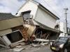 Japan quake toll rises to 13 as rescuers haul people from collapsed mall
