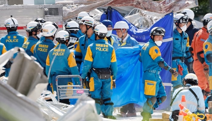 Rescue workers conduct a search operation at the damaged Aeon Mall shopping centre after an earthquake with a magnitude of 7.1 struck Japans southern Kumamoto Prefecture, in Kashima Town, Kumamoto Prefecture, Japan, July 30, 2026. — Reuters