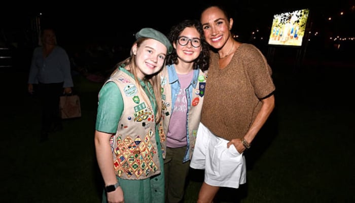 Meghan Markle beams in white shorts at Cookie Queens outdoor screening