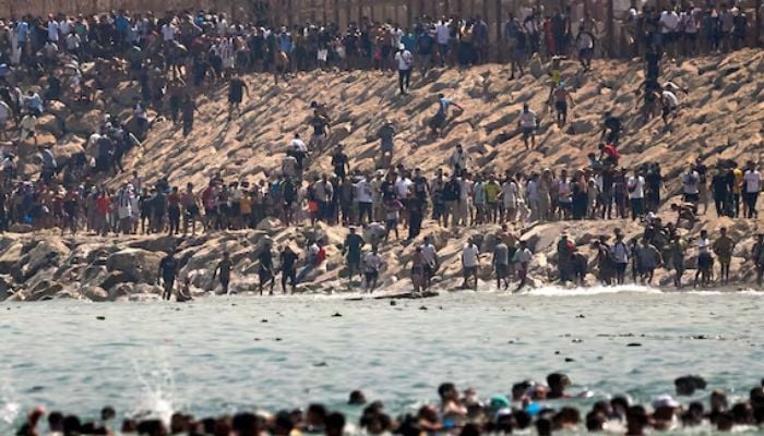 Why are Moroccans fleeing to Spain?