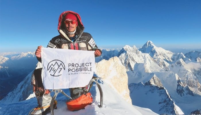 This photo released by Bremont Project Possible on July 18, 2019 shows Nirmal Purja at the summit of Gasherbrum II in Gilgit-Baltistan.—AFP