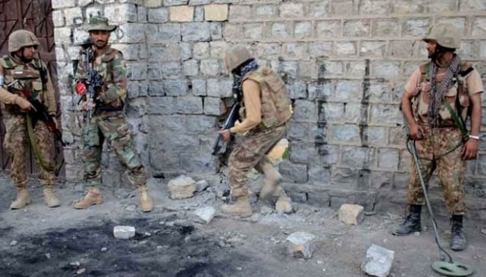 In this file photo, security forces are seen taking position during an operation. — ISPR/File
