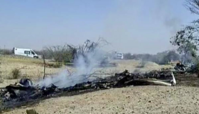 Smoke rises from the wreckage of a crashed tourist aircraft as firefighters respond at the scene. — Screengrab via TVPeru