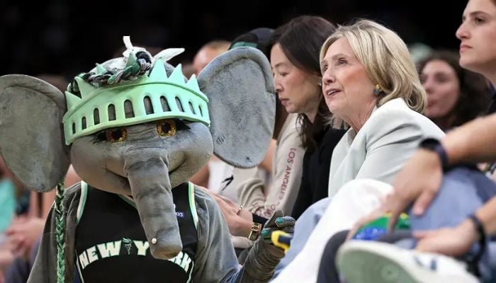 Hillary Clinton cheers on Ellie the Elephant during Liberty game halftime show