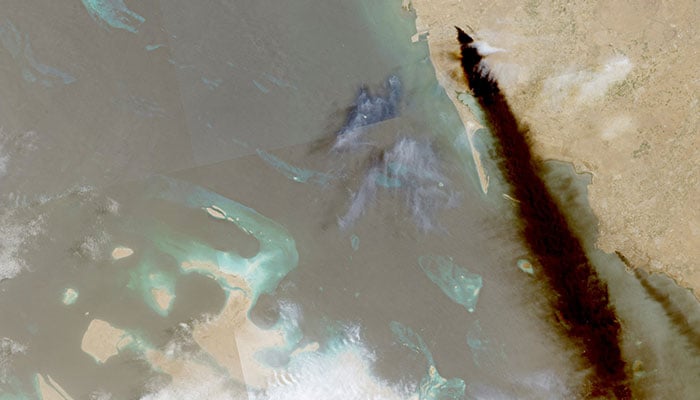 A composite satellite image shows trail of smoke rising from an oil facility, in Jizan, Jazan province, Saudi Arabia, July 26, 2026. — Reuters