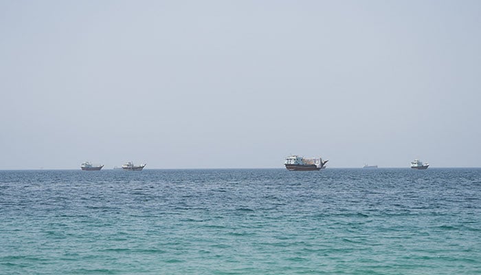 Vessels near the Strait of Hormuz, as seen from Musandam, Oman, August 6, 2026. — Reuters