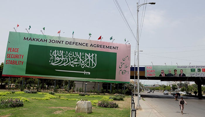 Billboards display Saudi Arabia flag and portraits of Saudi Crown Prince and Prime Minister Mohammed bin Salman, Prime Minister Muhammad Shehbaz Sharif, Chief of Defence Forces (CDF) and Chief of Army Staff, Field Marshal Asim Munir, and Turkish President Recep Tayyip Erdogan, following the signing of the Makkah Joint Defence Agreement, in Karachi, August 9, 2026. — Reuters