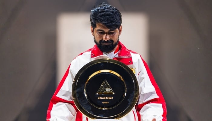 Pakistan’s Khawaja Muhammad Zubair celebrates after lifting the trophy following his victory over South Korea’s LowHigh to claim the Tekken 8 title at the Esports World Cup 2026 at Paris Expo Porte de Versailles in France on August 8, 2026. - Instagram/ewc_en