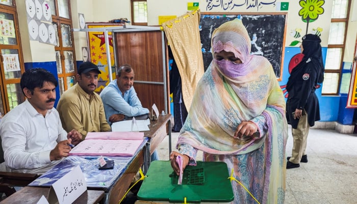 A woman votes during the second phase of the Azad Jammu and Kashmir (AJK) Legislative Assembly elections at a polling station in Muzaffarabad, August 2, 2026. — Reuters