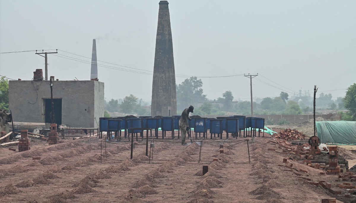 A man works at a brick kiln in Sheikhupura, Punjab province on July 20, 2026. — AFP