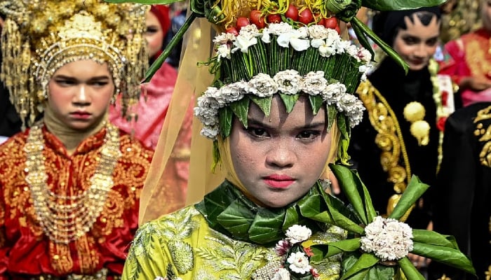 A 2023 image of Indonesians taking part in the street culture carnival to celebrate independence anniversary in Banda Aceh. — AFP