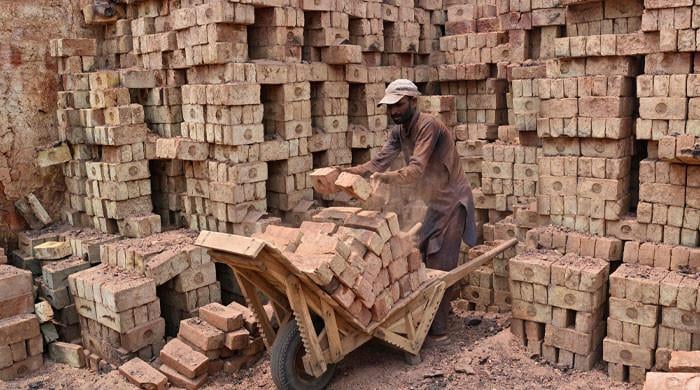 Brickmakers in Punjab's Sheikhupura scorched by sun above and fire below