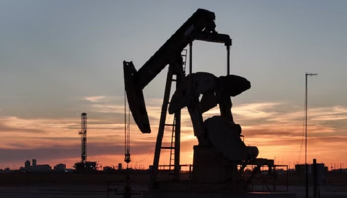 A drone view of a pump jack and drilling rig south of Midland, Texas, US June 11, 2025. — Reuters