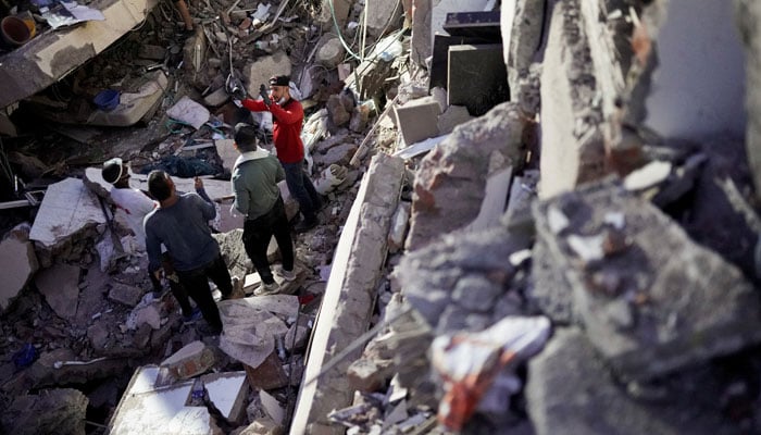 Rescuers work at the site of a collapsed building following an earthquake, in Cali, Colombia, August 10, 2026. — Reuters