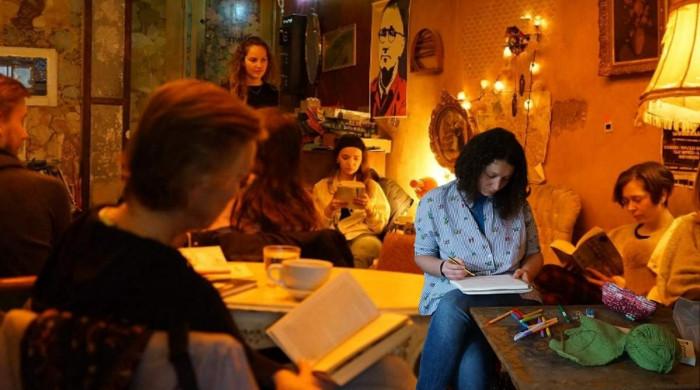 Amsterdam cafe goes offline with 'reading raves' for digital detox—Gen Z queues up