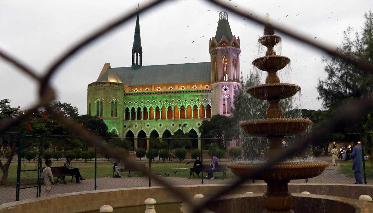 Frere Hall building is illuminated with colourful lights as part of preparations for 79th Independence Day celebrations. — APP