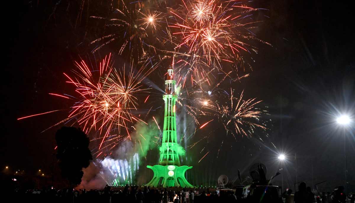 People watch fireworks explode over the Minar-e-Pakistan national monument during celebrations of 79th anniversary of Pakistan in Lahore on August 14, 2026. — APP