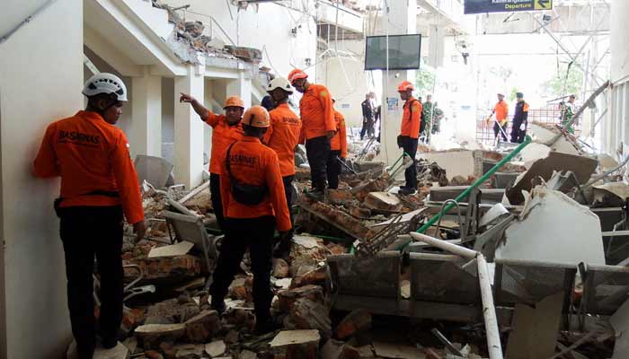 Rescuers inspect a heavily-damaged building at L. Say port following an earthquake in Maumere, Sikka, East Nusa Tenggara province, Indonesia, August 15, 2026.