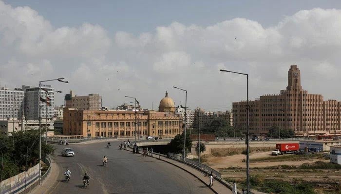 View of partial traffic with the Karachi Port Trust building, in the background, in Karachi, September 2, 2023. — Reuters
