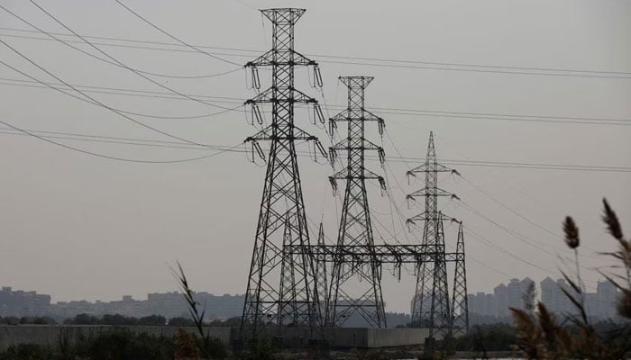 A power transmission tower is seen a day after a country-wide power breakdown, in Karachi, Pakistan, January 24, 2023. — Reuters