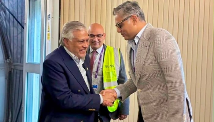 Deputy Prime Minister and Foreign Minister Ishaq Dar (left) is being recieved by Pakistani official at London Heathrow Airport on August 23, 2026. — X@ForeignOfficePk
