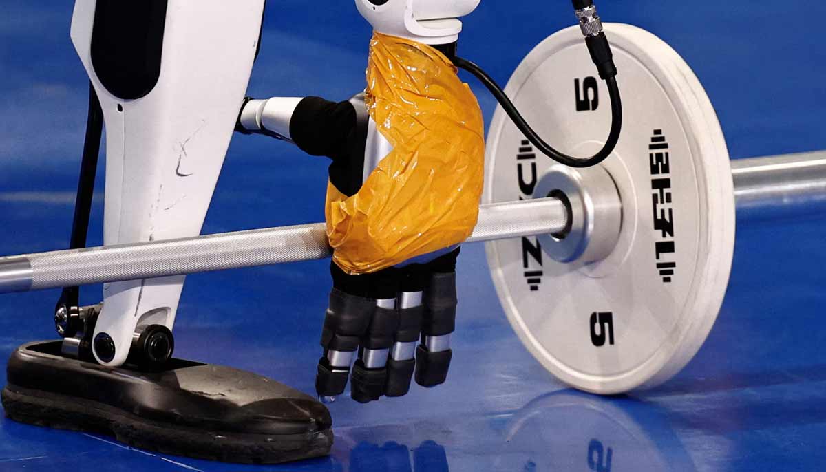 A Tiangong humanoid robot takes part in a weightlifting contest during the 2026 World Humanoid Robot Games at the National Speed Skating Oval in Beijing, China, on August 24.— Reuters