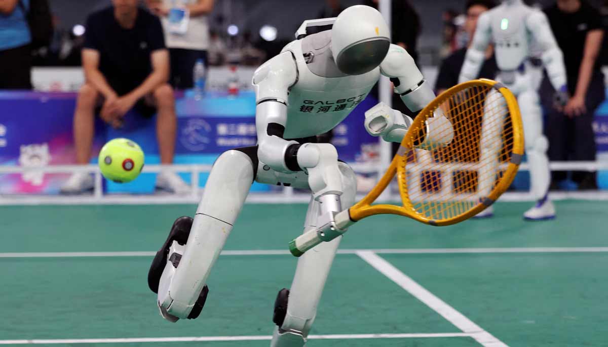 A Galbot humanoid robot dives for the ball during a demonstration of a tennis match with a human player, before the opening ceremony for the second World Humanoid Robot Games, at the National Speed Skating Oval in Beijing, China, on August 22.— Reuters
