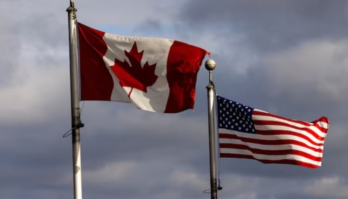 Flags wave in the wind near the Detroit River which seperates Windsor, Ontario, Canada, and Detroit, Michigan, US, in Windsor, Ontario, Canada February 4, 2025. — Reuters