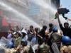 Indian police use water cannon at new protest over test paper leaks