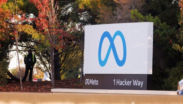 A security guard stands watch by the Meta sign outside the headquarters of Facebook parent company Meta Platforms in Mountain View, California, US. — Reuters