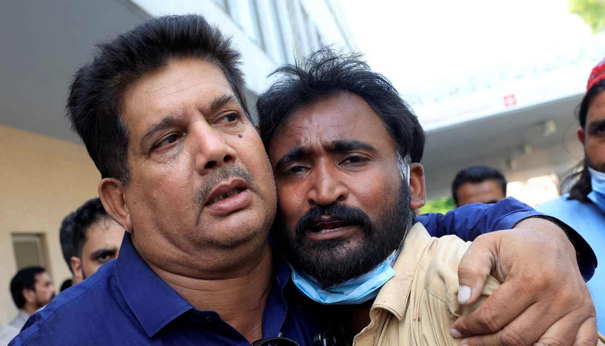 Samiullah, father of a newborn victim, is consoled following a deadly fire at the Pakistan Institute of Medical Sciences (PIMS) hospital in Islamabad, Pakistan, August 26, 2026.— Reuters