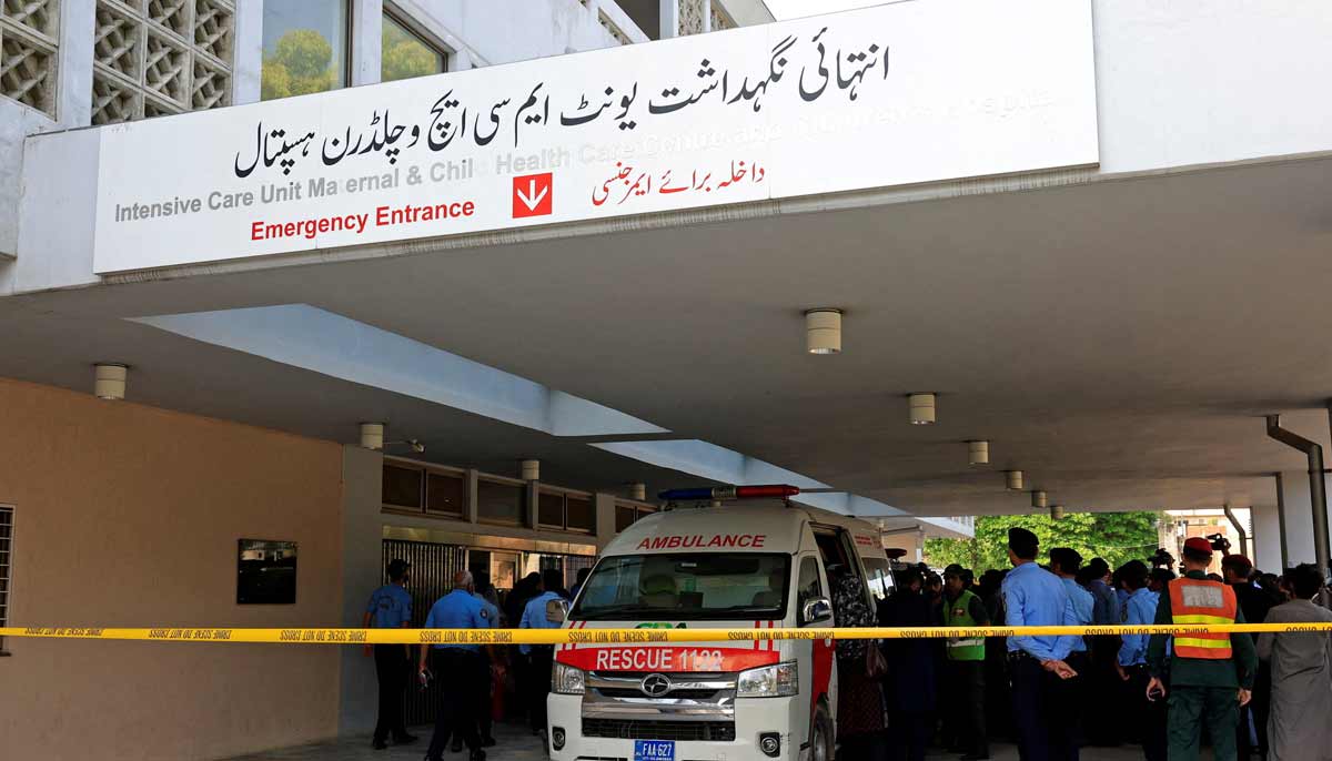 Police officers move past an ambulance outside an intensive care unit after a fire broke out at the Pakistan Institute of Medical Sciences (PIMS) hospital in Islamabad, Pakistan, August 26, 2026.— Reuters