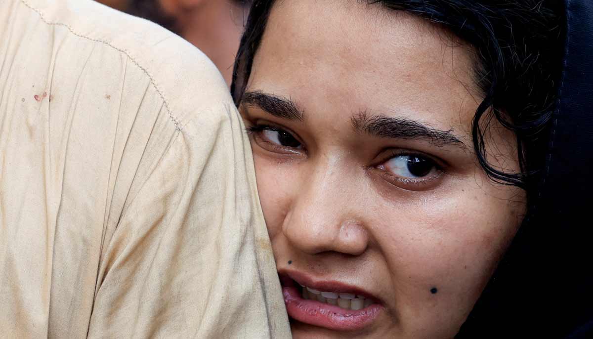 Javeria, mother of a newborn victim, leans on her husband’s shoulder as she mourns following a deadly fire at the Pakistan Institute of Medical Sciences (PIMS) hospital in Islamabad, Pakistan, August 26, 2026.— Reuters