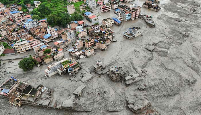 A drone view shows mud covering properties following a flash flood in Trishuli, Nuwakot district, Nepal, August 27, 2026. — Reuters