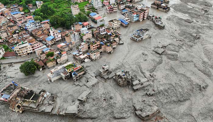 A drone view shows mud covering properties following a flash flood in Trishuli, Nuwakot district, Nepal, August 27, 2026. — Reuters