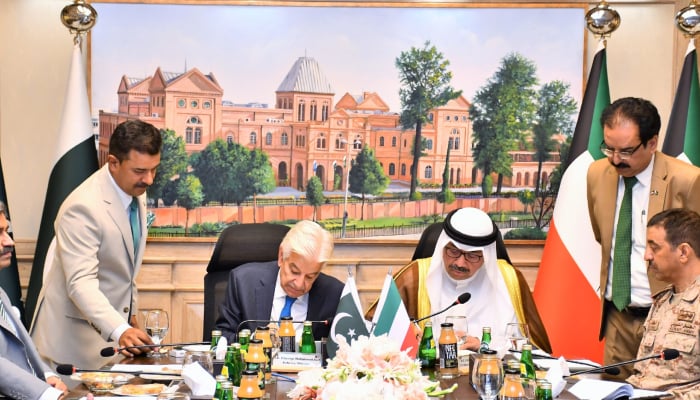 Defence Minister Khawaja Muhammad Asif (centre left) signs the Protocol Agreement-2026 along with Kuwaits Minister of Defence Sheikh Abdullah Ali Abdullah Al-Saleem Al-Sabah in Islamabad, on August 27, 2026. — Ministry of Defence