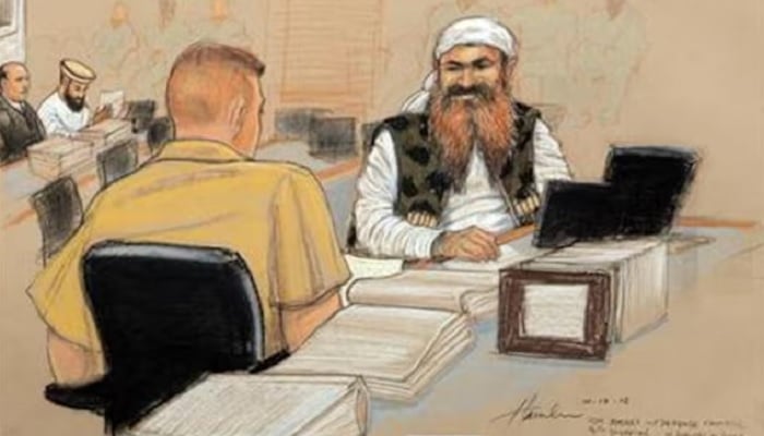Khalid Sheikh Mohammed (R), the alleged mastermind of the September 11 attacks, speaks with his defence lawyer on the third day of pre-trial hearings in the 9/11 war crimes prosecution, as depicted in this Pentagon-approved courtroom sketch at the U.S. Naval Base Guantanamo Bay, Cuba, October 17, 2012.— Reuters