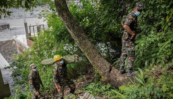 An Army rescue team treks uphill as they look for survivors in areas affected by flash floods and a mudslide, in Trishuli, Nuwakot district, Nepal, August 29, 2026.— Reuters