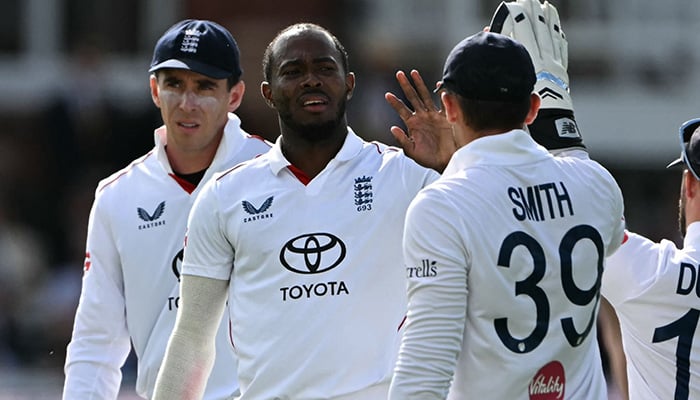 Englands Jofra Archer (C) celebrates with teammates after bowling Pakistans Ali Usman on day two of the second Test match between England and Pakistan at Lords cricket ground in Leeds, London, on August 28, 2026. — AFP