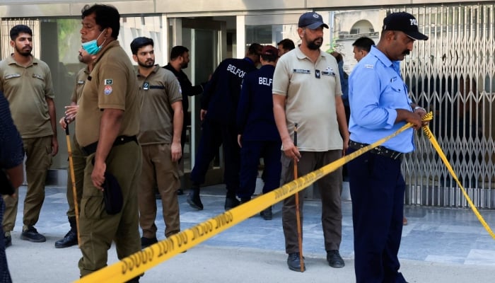 A police personnel cordons off the entrance area, a day after a deadly fire at the Pakistan Institute of Medical Sciences hospital in Islamabad, August 27, 2026. — Reuters