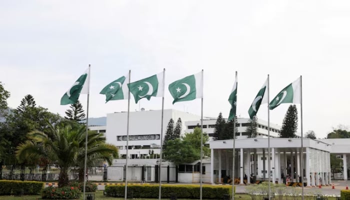 Pakistani flags flutter near the Parliament House in Islamabad, April 11, 2026. — Reuters