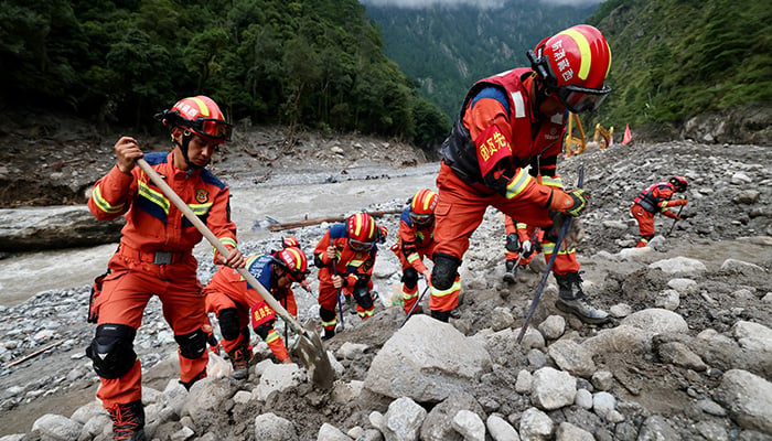 Rescue workers clear debris during search operations near the Gyirong port after a mudslide, in Shigatse, Tibet, China August 29, 2026. — Reuters