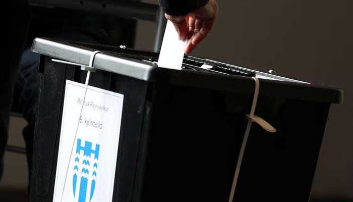 A person casts a vote for the national referendum on resuming EU membership talks in Reykjavik, Iceland, on August 29, 2026. — Reuters