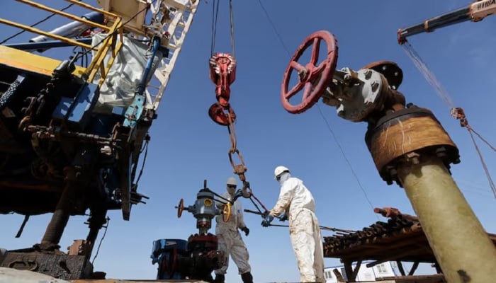 Specialists work at a drilling rig at the Airankol oil field operated by Caspiy Neft in the Atyrau region, Kazakhstan, April 20, 2026.— Reuters